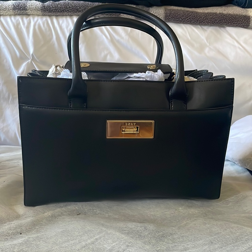 DKNY multi compartment black leather satchel. USED ONCE.